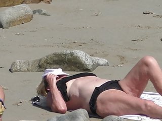 Wooly light-haired grandmother sunbathing